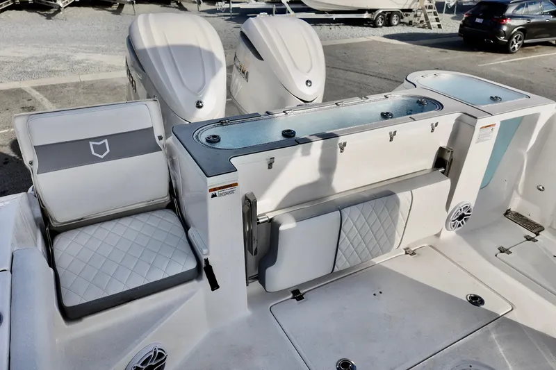 Slide: The Image of 2026 Sea Fox 328 Commander boat interior with seating and storage compartments. - 21