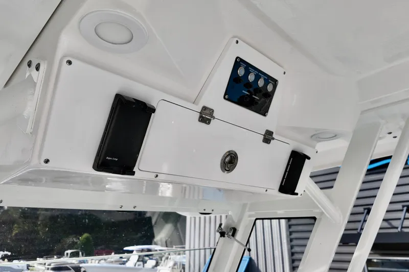 Slide: The Image of 2026 Sea Fox 328 Commander interior console with storage and control panel. - 25