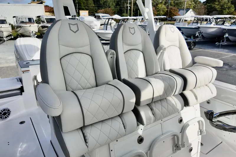 Slide: The Image of Luxury seating on 2026 Sea Fox 328 Commander boat, featuring plush, quilted design. - 29