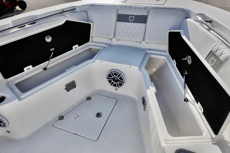 Slide: The Image of 2026 Sea Fox 328 Commander boat interior with open storage compartments and speaker. - 32