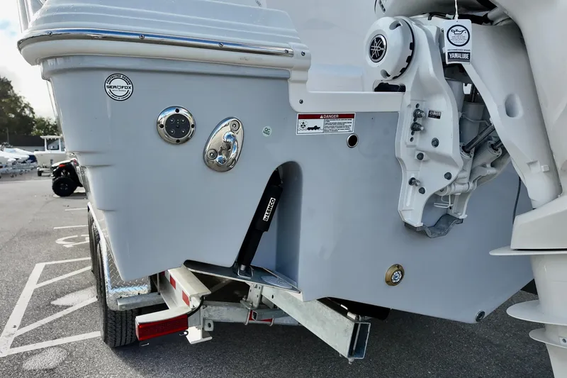 Slide: The Image of 2026 Sea Fox 328 Commander boat stern with motor and trailer details. - 34