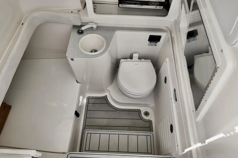 Slide: The Image of 2026 Sea Fox 328 Commander boat bathroom with sink and toilet. - 4