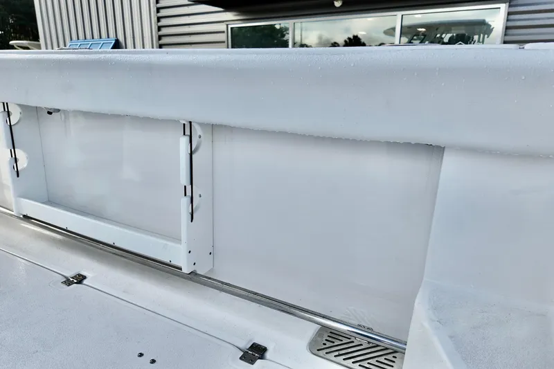 Slide: The Image of 2026 Sea Fox 328 Commander boat deck with storage compartments and sleek design. - 8