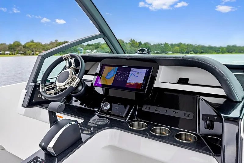 Slide: The Image of Manufacturer Provided Image: 2026 Monterey Elite 27 OB boat dashboard with modern controls and navigation system. - 3