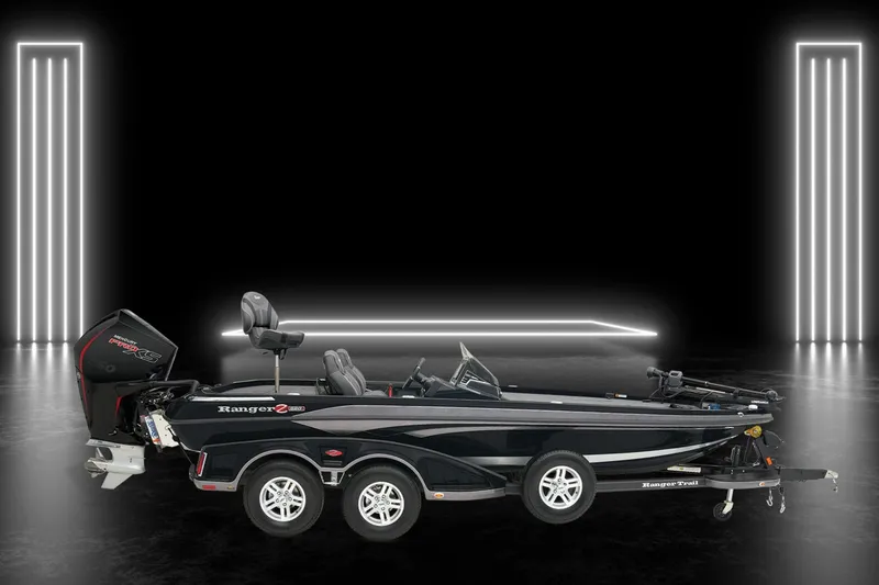 Slide: The Image of 2024 Ranger Z520R boat in sleek showroom with modern lighting. - 3
