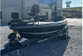 Slide: The Image of 2024 Ranger Z520R boat on trailer outside a building. - 4