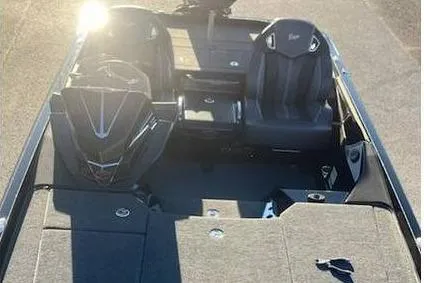 Slide: The Image of 2024 Ranger Z520R boat interior with seating and storage compartments. - 7