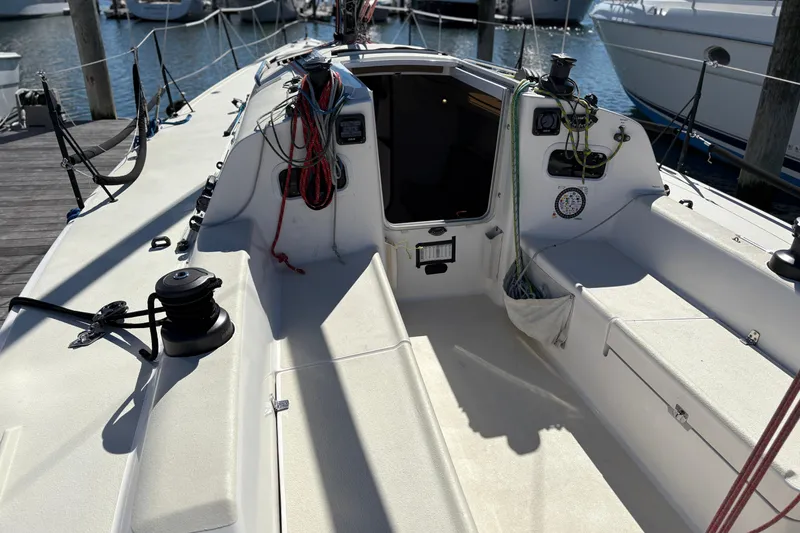 Slide: The Image of 2014 J Boats J/111 sailboat cockpit with ropes and winches at dock. - 10