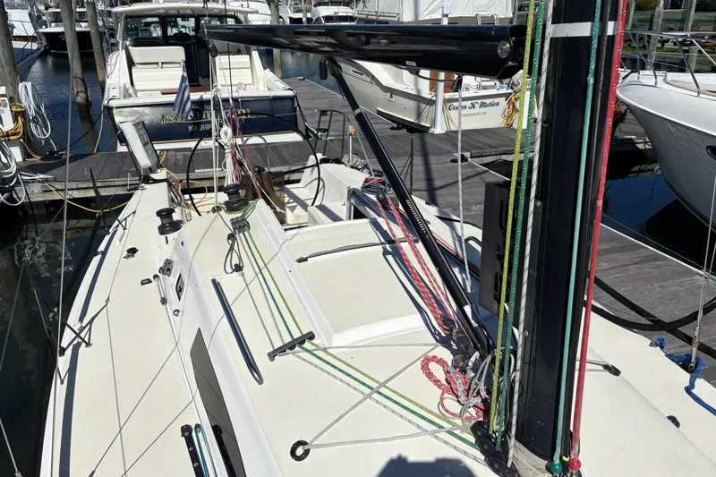 Slide: The Image of 2014 J Boats J/111 sailboat deck with rigging and docked yachts. - 11
