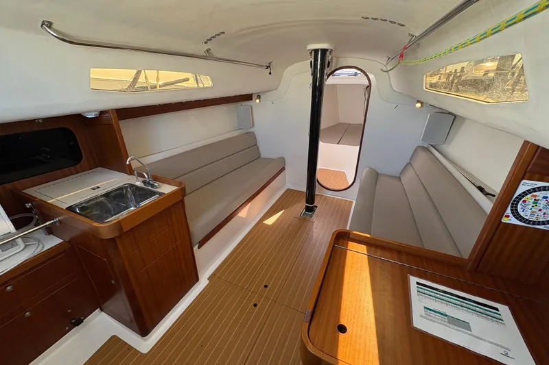 Slide: The Image of Interior of 2014 J Boats J/111 sailboat with wood finish and compact galley. - 19