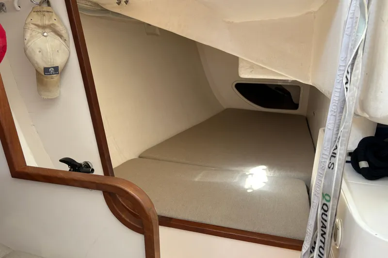 Slide: The Image of Cozy cabin interior of 2014 J Boats J/111 sailboat with beige cushions and wooden accents. - 22