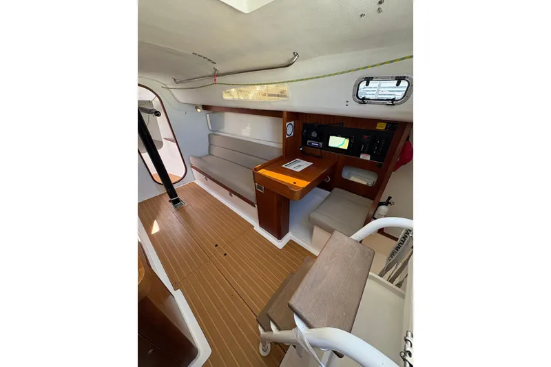 Slide: The Image of 2014 J Boats J/111 interior with navigation station and seating area. - 25