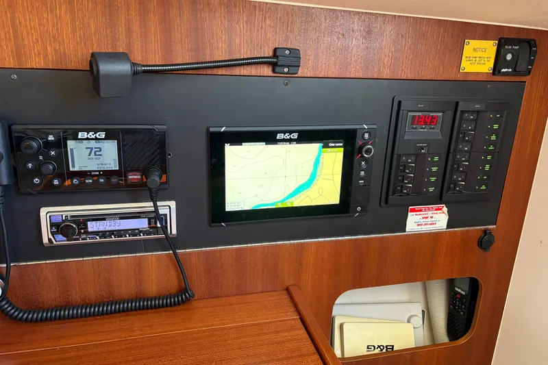 Slide: The Image of Control panel of a 2014 J Boats J/111 with navigation and communication equipment. - 27