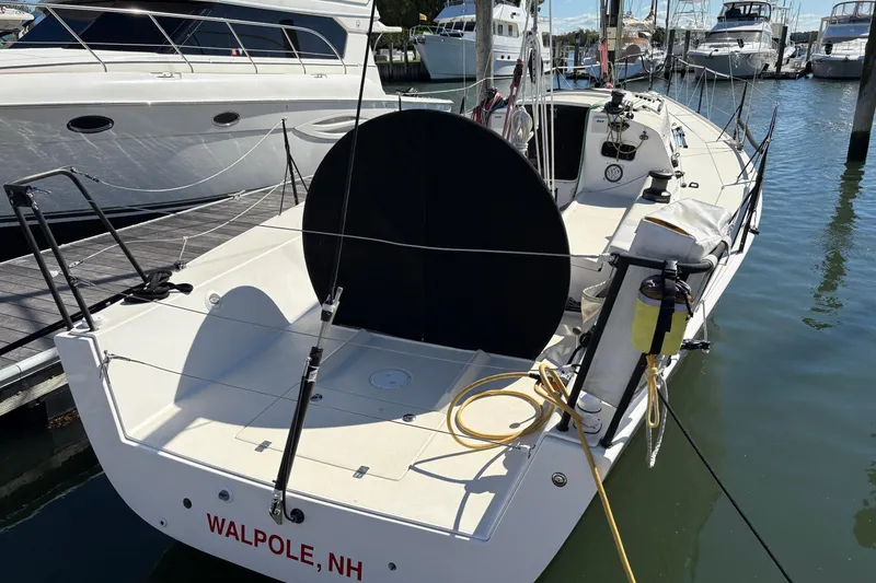 Slide: The Image of 2014 J Boats J/111 sailboat docked, featuring a sleek design and spacious deck. - 4