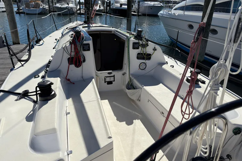 Slide: The Image of 2014 J Boats J/111 sailboat cockpit with ropes and winches at marina. - 7