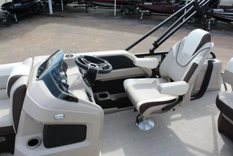 Slide: The Image of 2026 Avalon LSZ Cruise Rear Bench 21 boat interior with steering console and seating. - 14