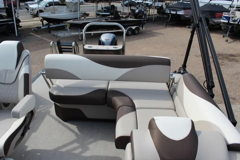 Slide: The Image of 2026 Avalon LSZ Cruise Rear Bench 21 with stylish seating in a boat showroom. - 15