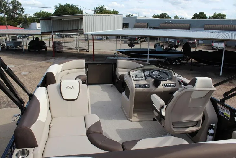 Slide: The Image of 2026 Avalon LSZ Cruise Rear Bench 21 pontoon boat interior with seating and helm. - 18