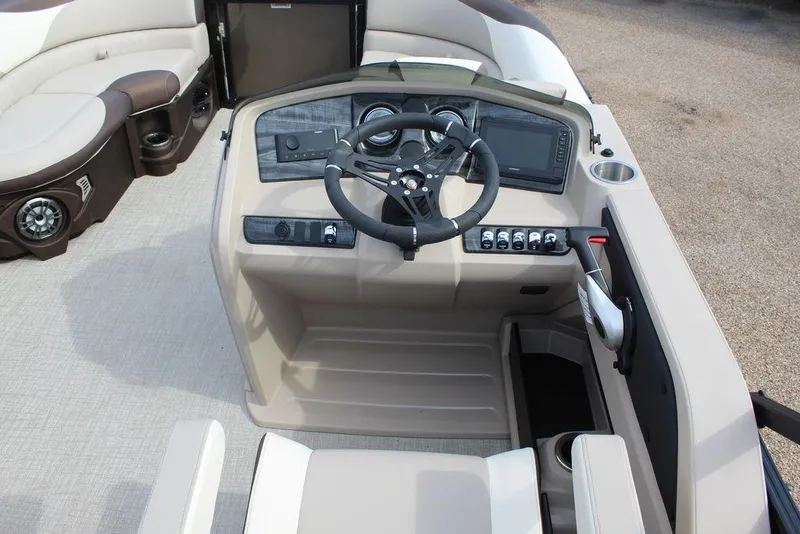 Slide: The Image of 2026 Avalon LSZ Cruise Rear Bench 21 boat dashboard with steering wheel and controls. - 19