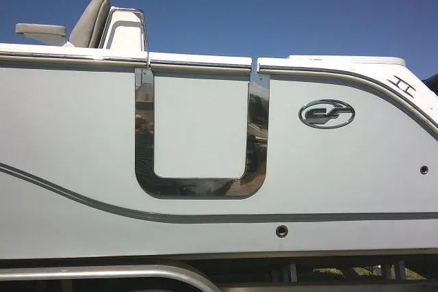 Slide: The Image of 2021 Sea Fox 288 Commander boat side view with sleek design and logo. - 10