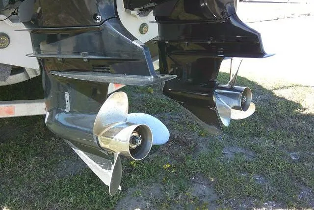 Slide: The Image of Twin outboard motors on a 2021 Sea Fox 288 Commander boat, displayed on grass. - 14