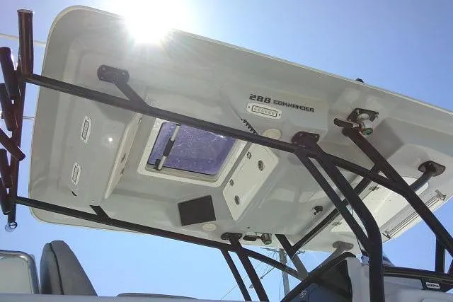 Slide: The Image of 2021 Sea Fox 288 Commander boat canopy with sunlight and structural details. - 19