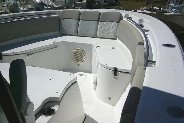 Slide: The Image of 2021 Sea Fox 288 Commander boat interior with cushioned seating and storage compartments. - 20