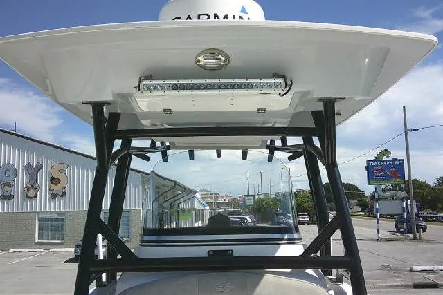 Slide: The Image of 2021 Sea Fox 288 Commander boat with Garmin equipment, parked near a store. - 25