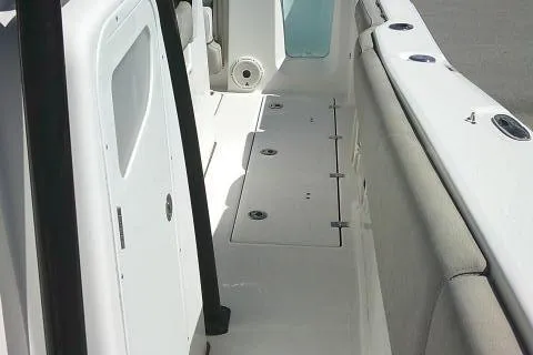 Slide: The Image of 2021 Sea Fox 288 Commander boat interior, featuring sleek white design and spacious seating. - 30