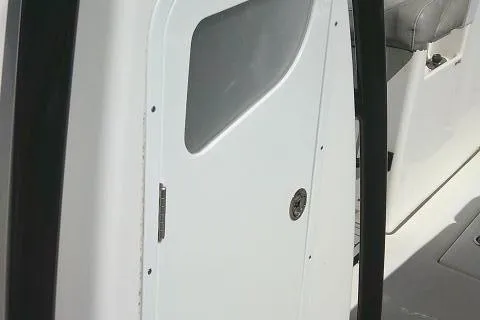 Slide: The Image of 2021 Sea Fox 288 Commander boat interior with white door and seating. - 31