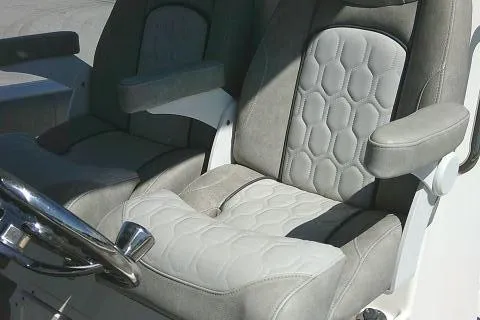Slide: The Image of 2021 Sea Fox 288 Commander boat seats with gray upholstery and armrests. - 32