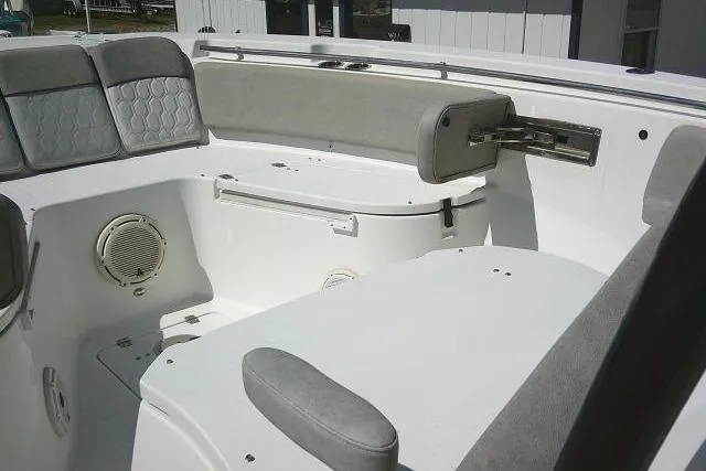 Slide: The Image of 2021 Sea Fox 288 Commander boat interior with cushioned seating and storage compartments. - 35