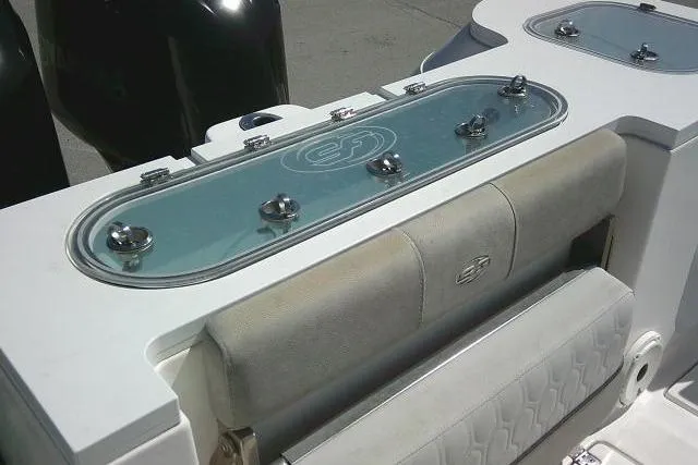 Slide: The Image of 2021 Sea Fox 288 Commander boat interior with cushioned seating and storage compartments. - 45