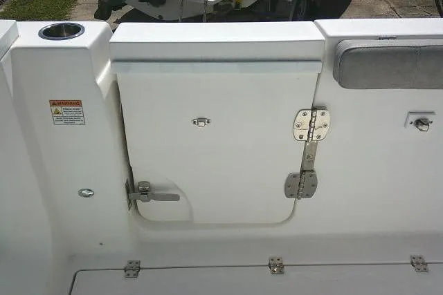 Slide: The Image of 2021 Sea Fox 288 Commander boat interior, featuring a white access door with metal hinges. - 46