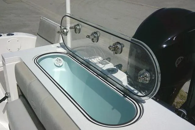 Slide: The Image of 2021 Sea Fox 288 Commander boat with open livewell and rod holders. - 49
