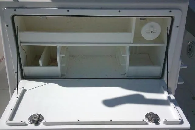 Slide: The Image of Storage compartment of 2021 Sea Fox 288 Commander boat, featuring organized shelves and compartments. - 54