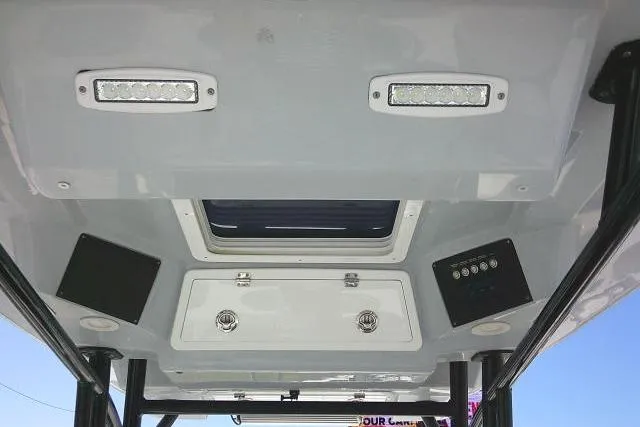 Slide: The Image of 2021 Sea Fox 288 Commander boat ceiling with lights and storage compartments. - 55