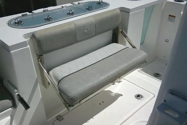 Slide: The Image of 2021 Sea Fox 288 Commander boat with foldable gray bench seat and storage area. - 61