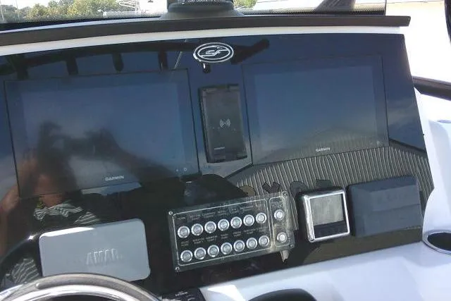 Slide: The Image of Dashboard of a 2021 Sea Fox 288 Commander with Garmin displays and controls. - 69