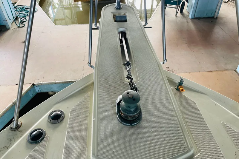 Slide: The Image of Bow of 1987 Tollycraft 40 Sport Sedan with anchor chain and winch. - 17