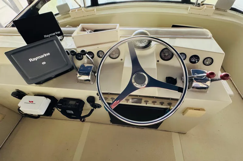 Slide: The Image of 1987 Tollycraft 40 Sport Sedan helm with Raymarine navigation system. - 20