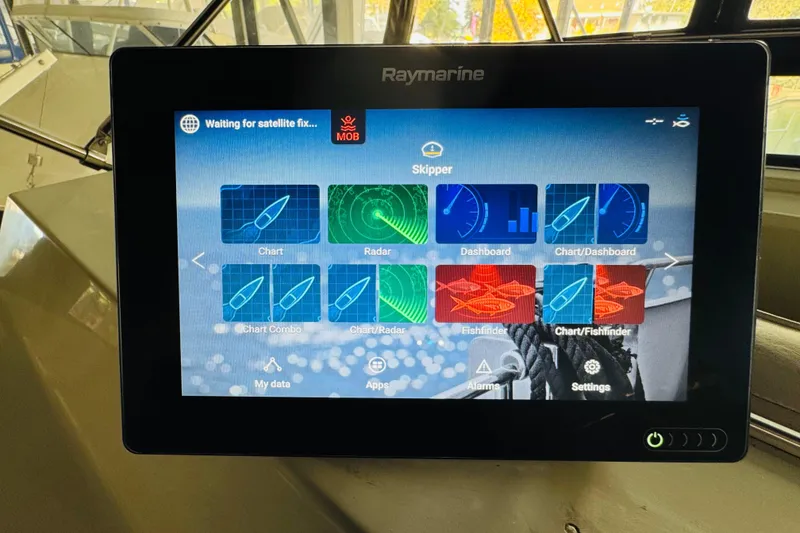 Slide: The Image of Raymarine navigation display on 1987 Tollycraft 40 Sport Sedan, showing chart and radar options. - 23