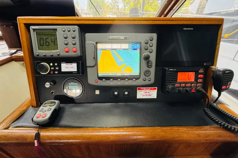 Slide: The Image of Control panel of a 1987 Tollycraft 40 Sport Sedan with navigation and communication equipment. - 35