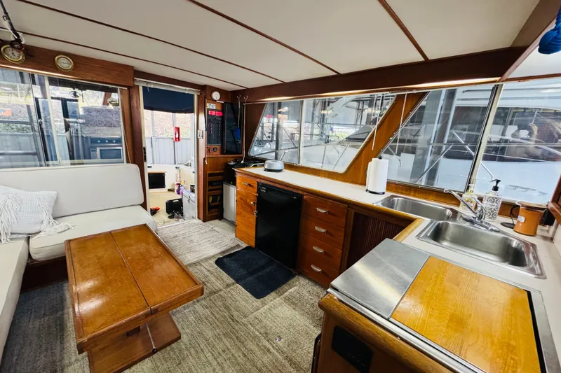 Slide: The Image of Interior of 1987 Tollycraft 40 Sport Sedan with kitchen and seating area. - 38