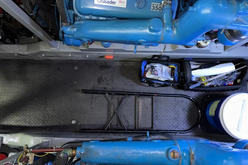 Slide: The Image of Engine room of 1987 Tollycraft 40 Sport Sedan with blue Crusader engines. - 50