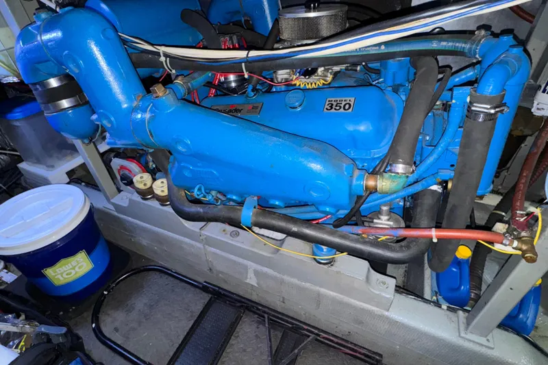 Slide: The Image of Engine compartment of a 1987 Tollycraft 40 Sport Sedan with a blue Model 350 engine. - 51