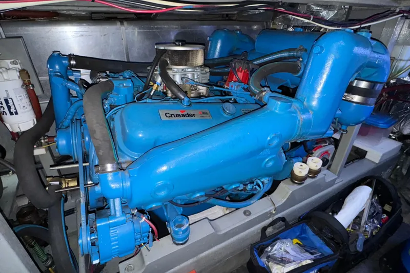 Slide: The Image of 1987 Tollycraft 40 Sport Sedan engine compartment with blue Crusader engine. - 52