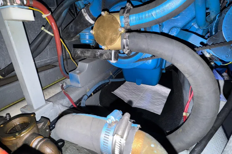 Slide: The Image of Engine compartment of a 1987 Tollycraft 40 Sport Sedan with hoses and components. - 54