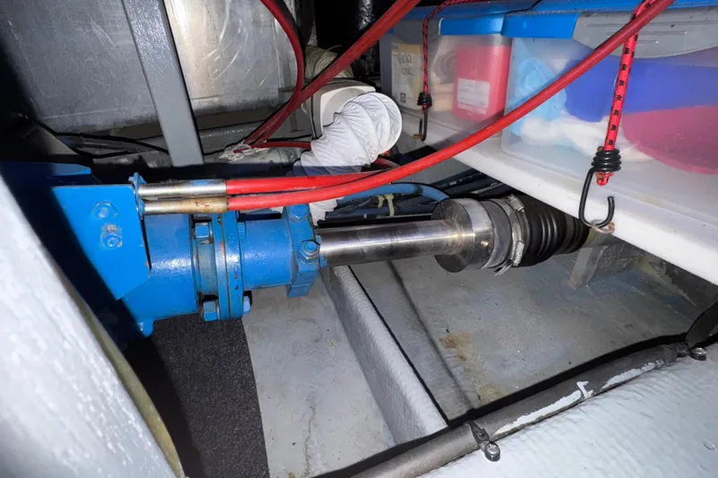 Slide: The Image of Engine compartment of a 1987 Tollycraft 40 Sport Sedan with visible mechanical components. - 57