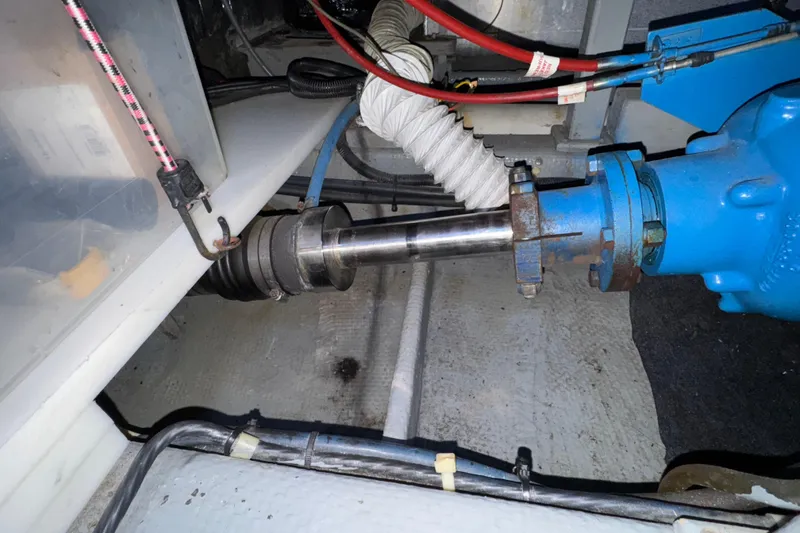 Slide: The Image of Engine compartment of 1987 Tollycraft 40 Sport Sedan showing mechanical components and wiring. - 58